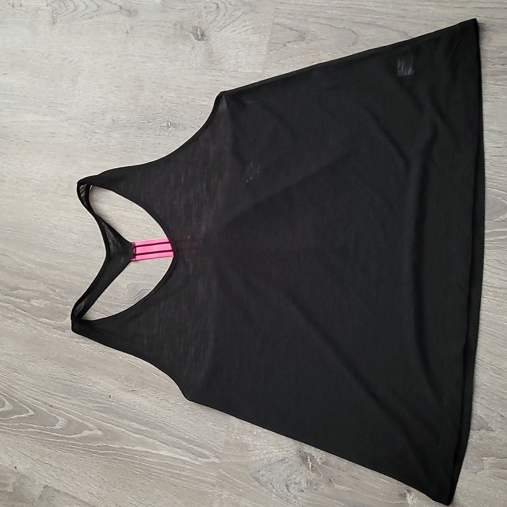 Workout shirt black and in the back a pink strap. LARGE, city streets